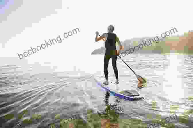 A Stand Up Paddler Riding A Wave With Confidence How To Increase Your Stand Up Paddling Performance