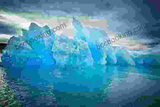 A Towering Iceberg Glistening Against The Backdrop Of Greenland's Icy Coastline 1940 Arctic Lights Desmond Holdridge Travel : Exploration Greenland