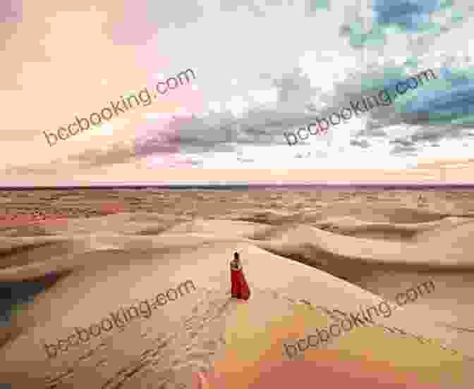 A Woman In A Red Dress Standing In The Desert Red: Passion And Patience In The Desert
