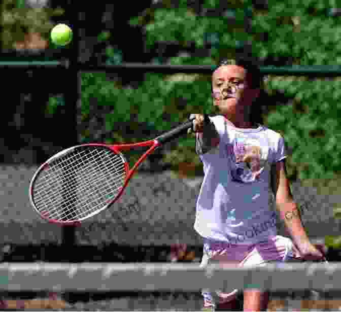A Young Tennis Player Practicing On The Court Teaching Tennis Volume 3: The Development Of Champions