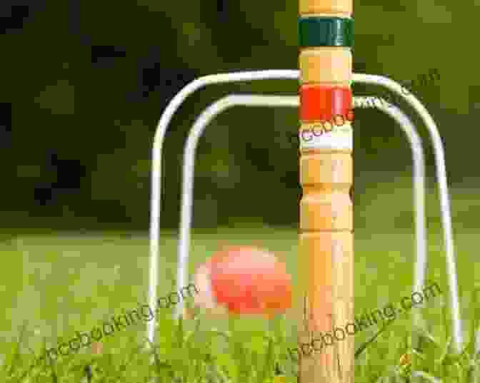 Two People Playing Croquet On A Lush Lawn, With A Croquet Wicket And Mallets In The Foreground. HOW TO PLAY CROQUET : Guide On How To Play Croquet(American Style) With Ease Shots Winnings Rues And Tips